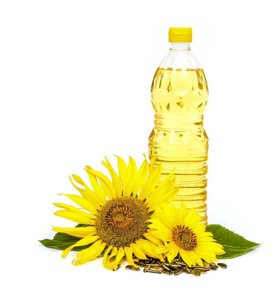Sunflower oil bottle with fresh sunflowers